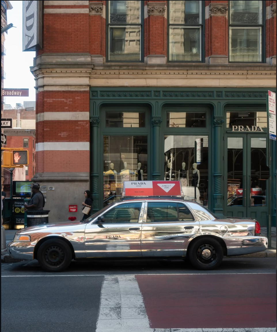Chrome Prada taxi outside a New York storefront